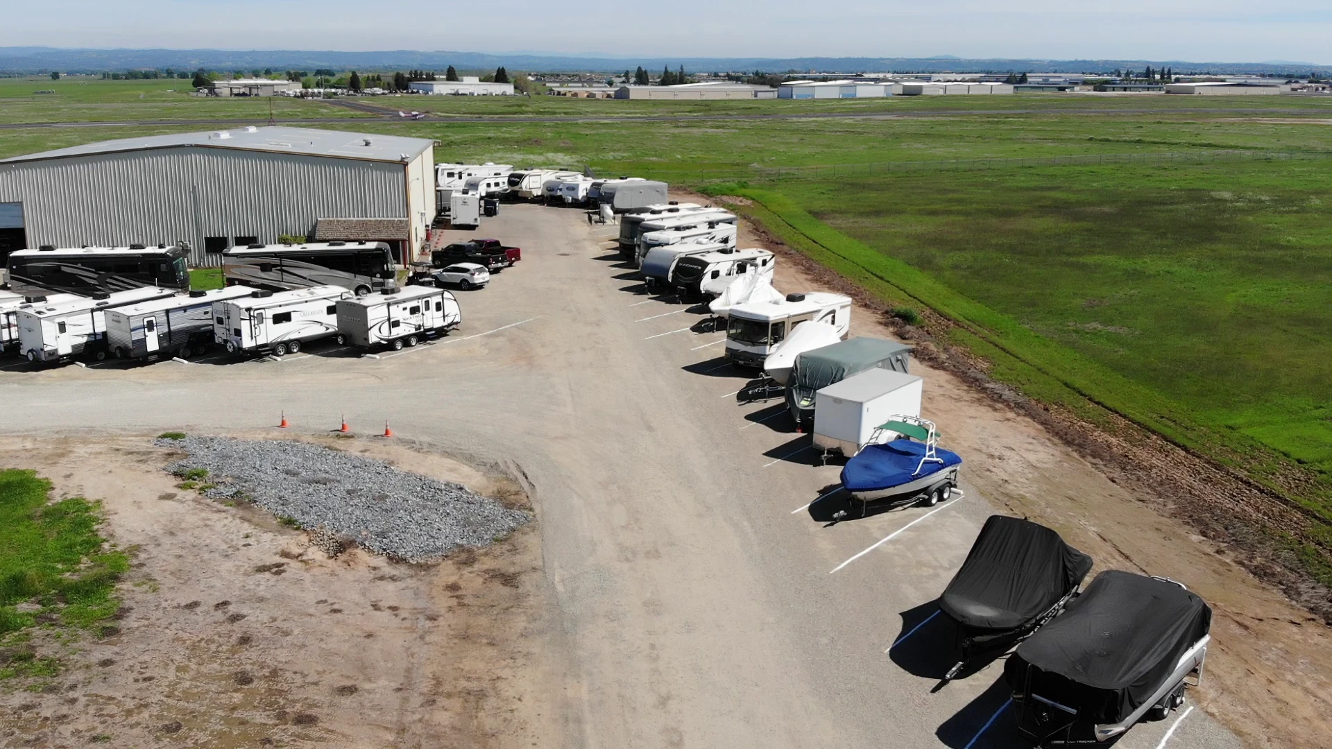 Facility building and RV storage row at Affordable RV and Boat Storage in Lincoln